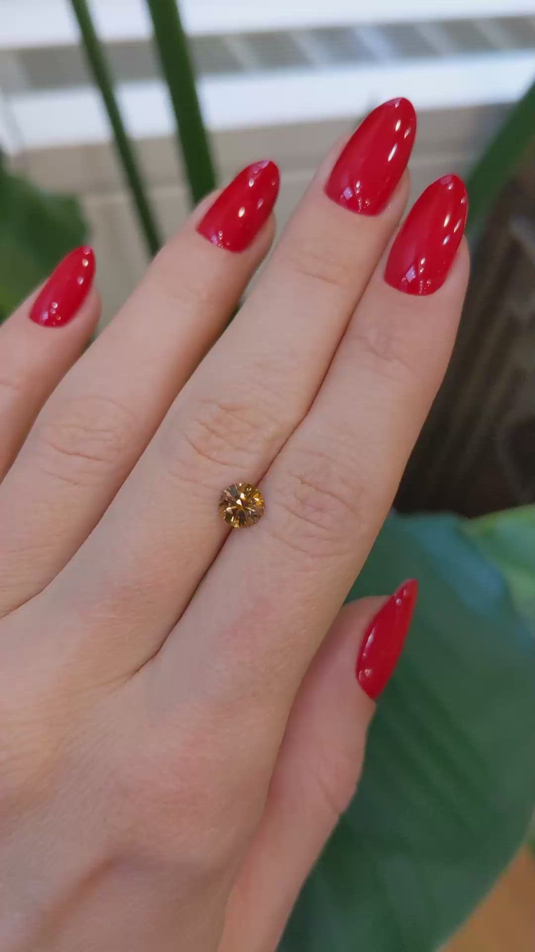 0.84 Ct. Orange Sapphire from Montana Size Video