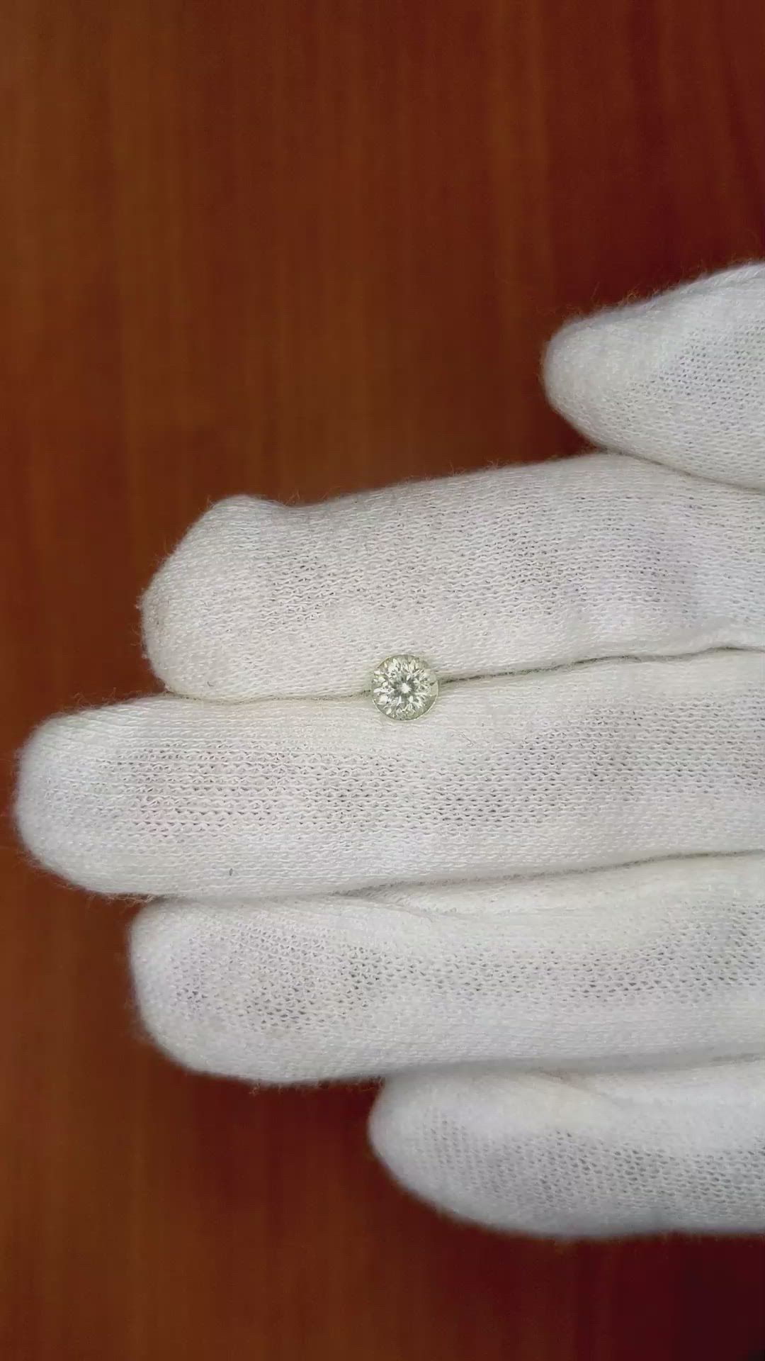 0.66 Ct. Greenish Brown Sapphire from Montana Size Video