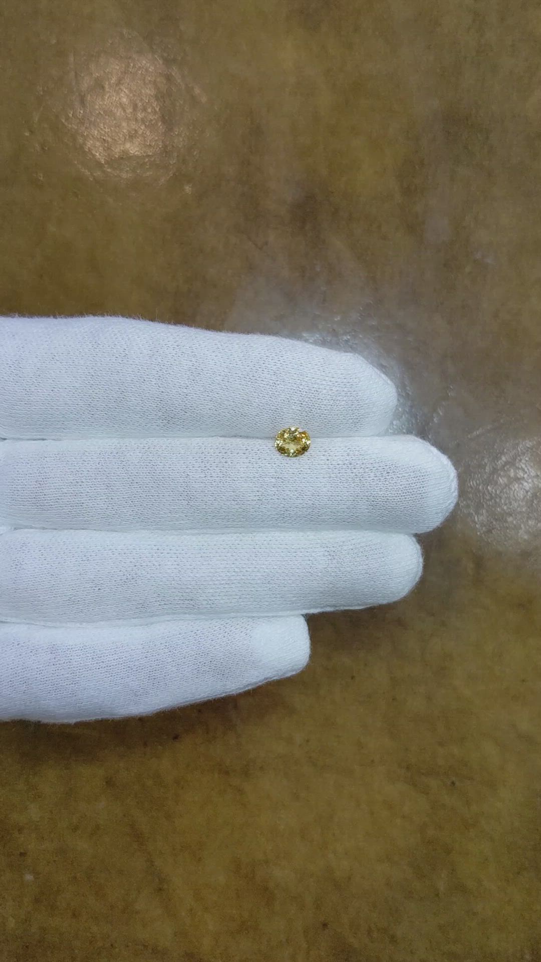 0.72 Ct. Yellow Sapphire from Montana Size Video