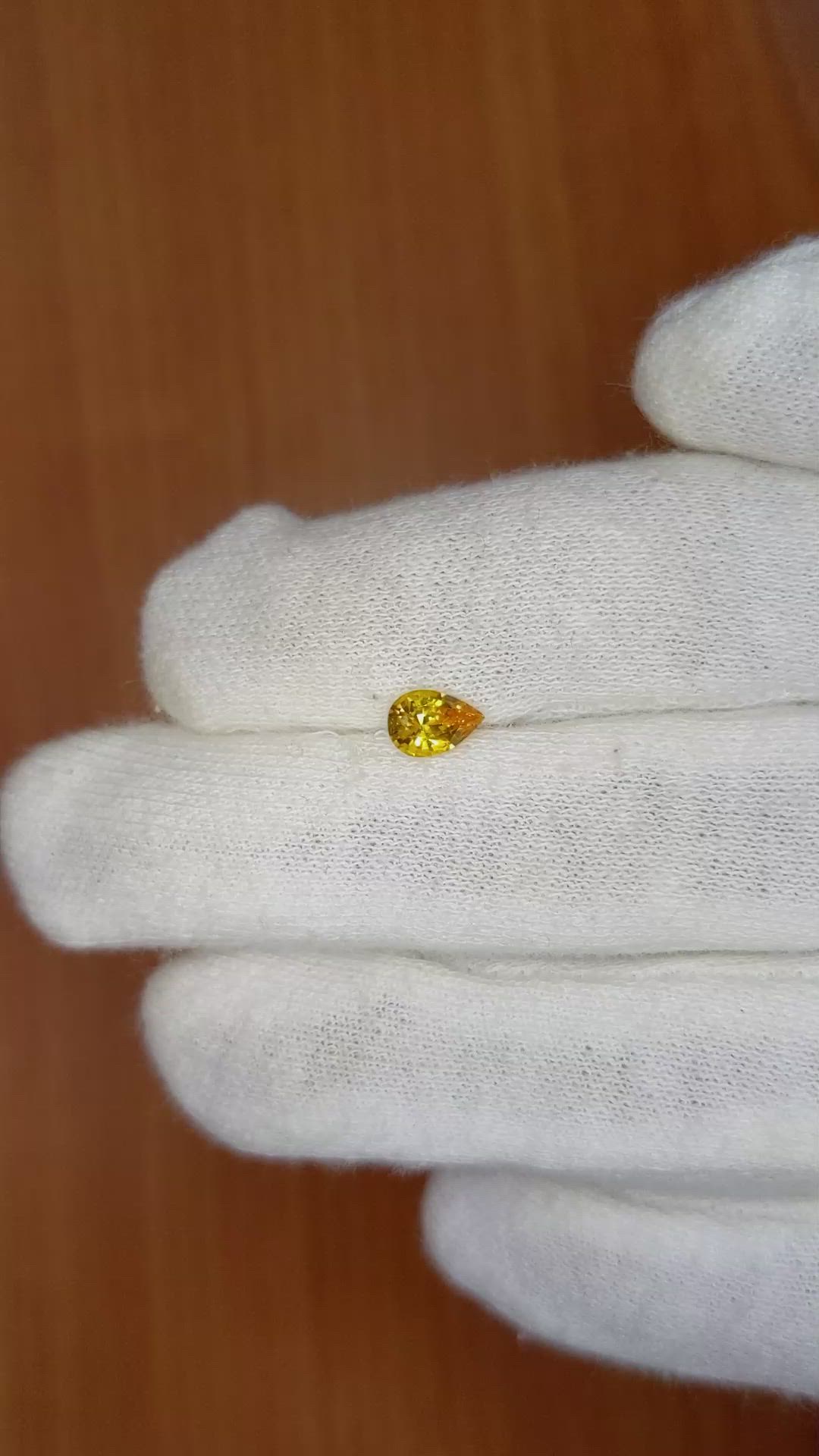 0.64 Ct. Orangish Yellow Sapphire from Ceylon (Sri Lanka) Size Video