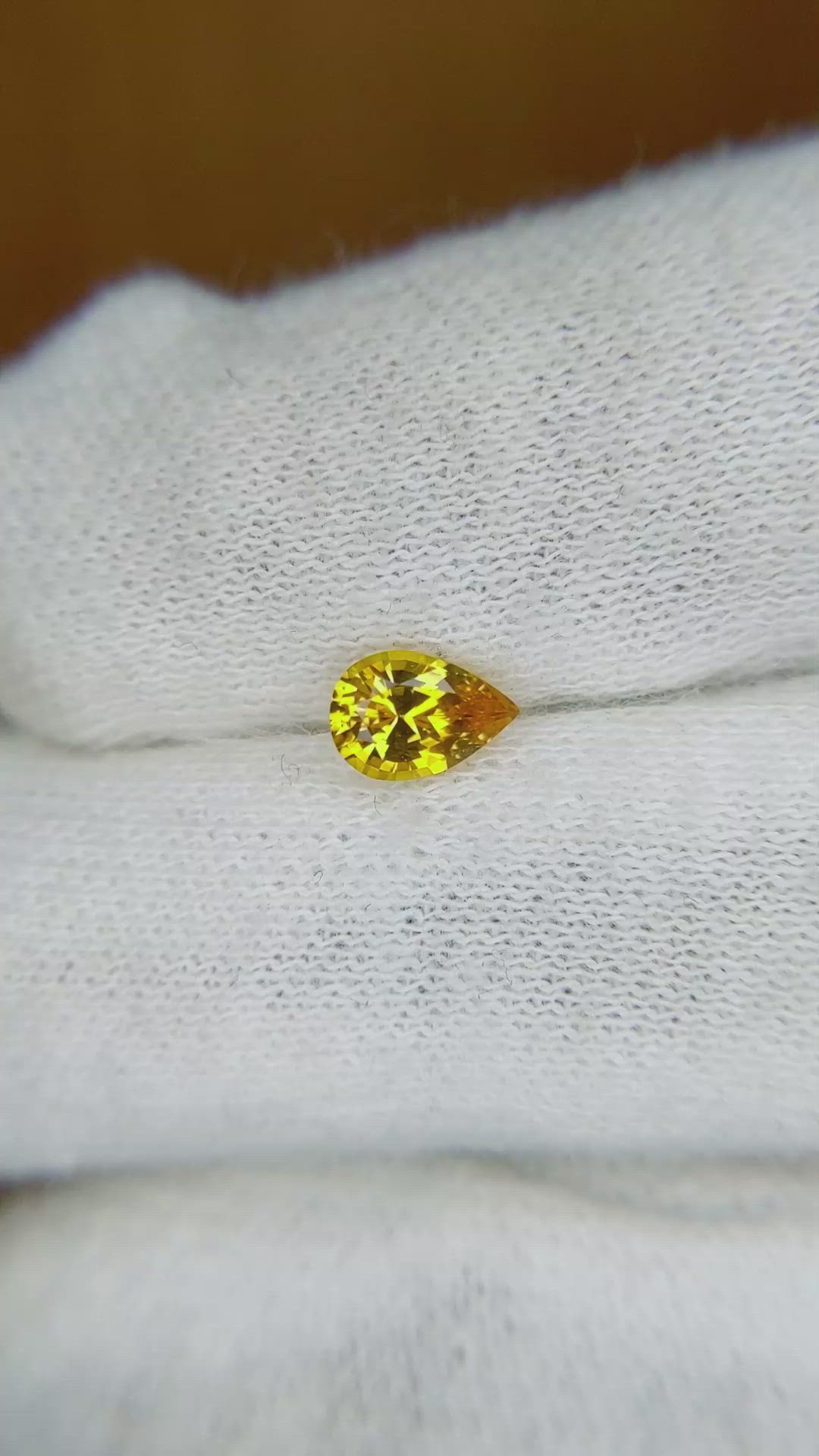 0.64 Ct. Orangish Yellow Sapphire from Ceylon (Sri Lanka) Size Video